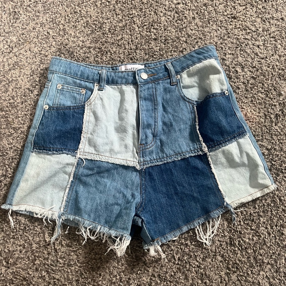 Graffiti Blue Denim Shorts With multi colored patches.